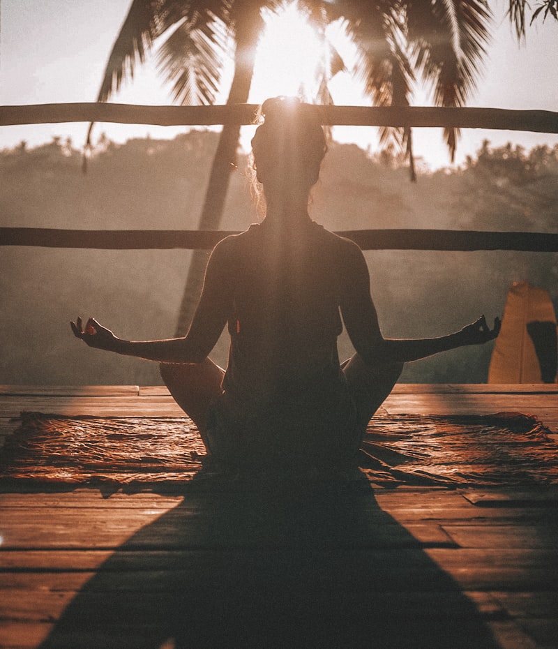Meditation silhouette at sunset &mdash; anxiety and stress relief